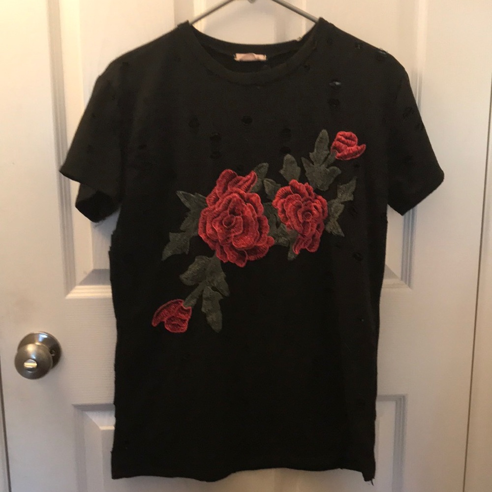 Black and red rose t-shirt. Has pre-sold holes